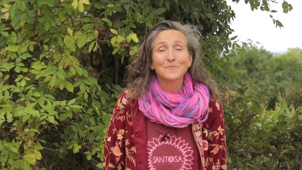 The old lady standing in the forest and wearing piece handwoven scarf | Yin Yoga journey